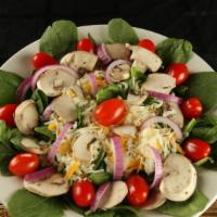 Spinach Salad · Spinach, red onion, mushrooms, tomato, and cheese. Recommended with Greek dressing.
