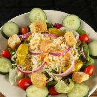House Salad · Salad greens, tomato, cucumber, pepperoncini, red onions, mozzarella, and croutons.