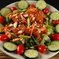 Buffalo Chicken Salad · Salad greens, tomato, cucumber, carrots, celery, and spicy buffalo chicken breast topped wit...
