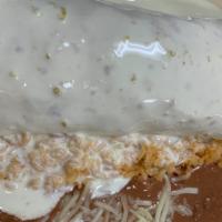 Wet Burrito · Flour tortilla, meat, grilled onions, tomatoes and lettuce. Covered with queso. Rice and bea...