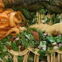 Charolazo · 20 street tacos served with meat, onions, cilantro, lime, grilled onions, jalapenos and radi...