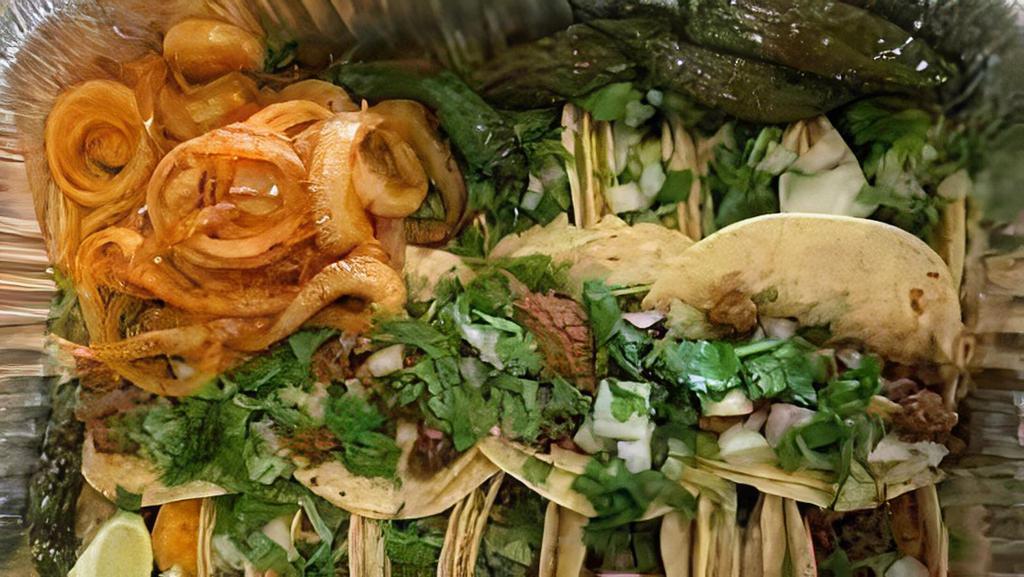 Charolazo · 20 street tacos served with meat, onions, cilantro, lime, grilled onions, jalapenos and radishes. Lengua and Tripa are not included.