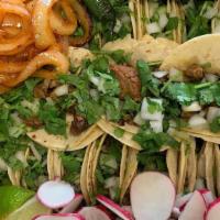 Mega Family Tray · 40 STREET TACOS WITH MEAT, ONIONS, CILANTRO, GRILLED ONIONS, RADISHES, LIME AND JALAPENOS. 
...