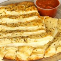 Garlic Bread · Fresh chopped garlic, butter, and spices on oven baked bread. Plenty to share. Side of dippi...