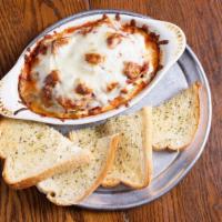 Lasagna · Covered with meatless sauce and mozzarella cheese. Choose any two pizza ingredients. Served ...