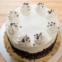 Cannoli Cake · Yellow cake with ricotta cream filling & a whipped border.