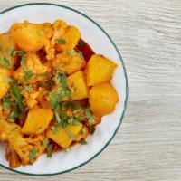 Aloo Gobi · Cauliflower cooked with potatoes, tomatoes, herbs and mild spices.