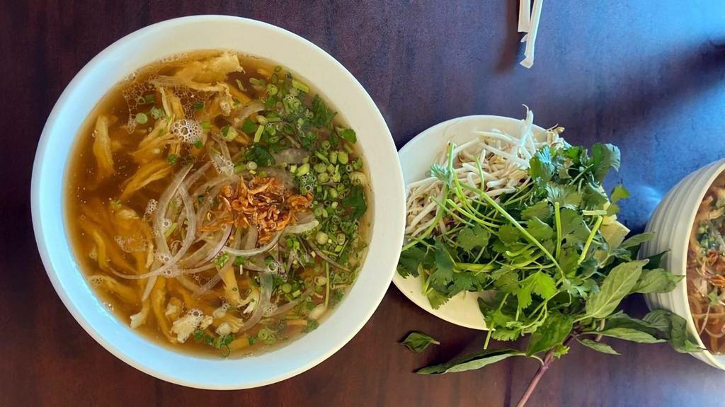Pho Chicken Noodle Soup (Pho Ga) · Shredded chicken breast in beef bone based pho broth. Pho noodles, bean sprouts, cilantro, basil, jalapeño, limes, siracha, hoisin, and onions are included and wrapped separately from broth.