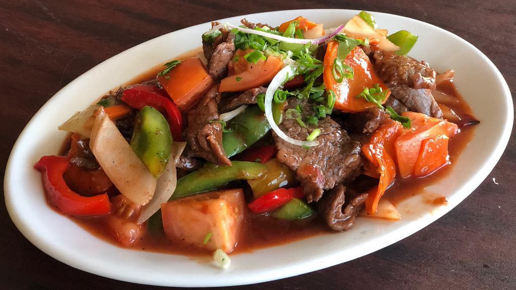Hoisin Beef · Round-eye peppered steak stir-fried with vegetables  (zucchini, carrots, tomatoes, bell peppers, and onions) garnished with a pinch on cilantro and red onions. Cooked in savory hoisin sauce.