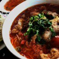 Bun Rieu · Tomato crab based soup with vermicelli noodles. Seafood paste, house-made pork and shrimp sa...