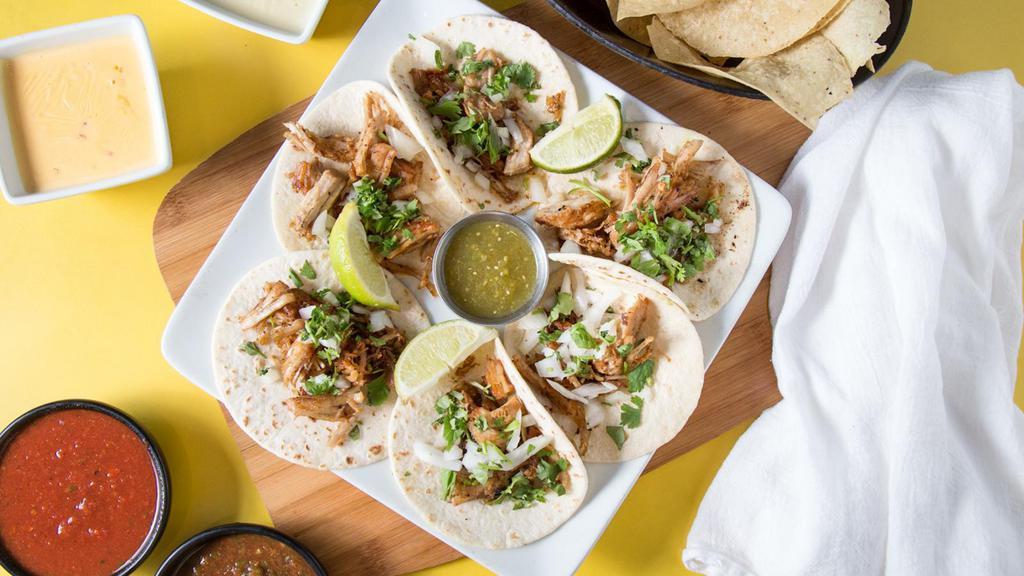 Street Tacos · Six tacos with carnitas pork, chicken, or steak, diced onions and cilantro. Served with tomatillo salsa and lime wedges.