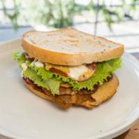 Smokey Club · Plant-based smoked turkey peppered bacon and ham topped with lettuce, tomatoes house mayonna...
