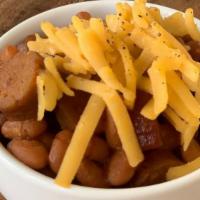 Beans And Franks · Baked beans, sliced hot dogs, topped with cheddar cheese.