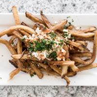 Cajun Fries · Topped with feta cheese, Cajun lemonato sauce and spices.