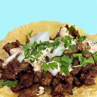 Arabes Tacos · Pork Shoulder and Bacon. Chipotle Crema with real sweet chipotles. Onion y Cilantro. Always ...