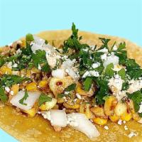 Elotes Tacos · Grilled street corn in a taco. Finished with chipotle crema, cotija  cheese, onions y cilant...
