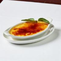 Elmo Creme Brulee · Traditional French recipe, prepared with Madagascar vanilla beans.
