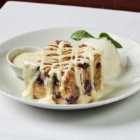 White Chocolate Blueberry Bread Pudding · Served with bourbon cream sauce.   Ice cream optional.