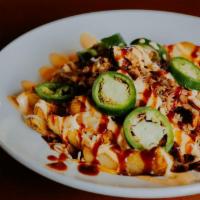 Dirty Fries · potato dippers, colby jack cheese, queso, caribbean bbq sauce, jalapenos, chipotle mayo