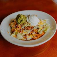 Walking Taco Bowl · Dorito Nacho flavored tortilla chips, beef & potato mix, lettuce, pico de gallo, co jack che...