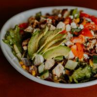 Charlie'S Chop Salad · grilled chicken, mixed greens, applewood smoked bacon, corn, sliced avocado, crumbled feta, ...