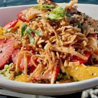 Asian Chopped Salad · Marinated Chicken, Asian Cucumber Slaw, Mandarin Oranges, Strawberries, Fried Wonton Strips,...