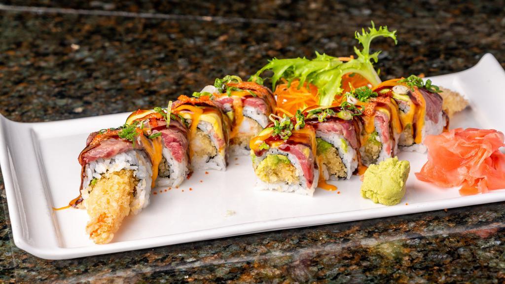 Asian Fusion Roll · Tempura shrimp and avocado roll topped with seared filet mignon. Served with ponzu sauce.