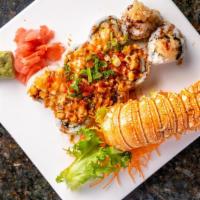 Lobster Tail Roll · Shrimp tempura with baked lobster, cucumber, eel sauce, tobiko, and spicy sauce.