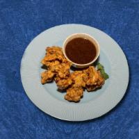 Traditional Veggie Fritter · Fried patties made from mixed vegetable marinated with herbs and spices