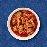 Clubhouse Lamb Curry · Lamb prepared with special sauce from fresh onions, garlic, and spices served with a side of...