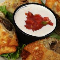 Southwest Egg Rolls · Two hand wrapped wonton rolls stuffed with our homemade black bean burger patty and pepper j...