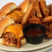 Bbq Pork Sliders · Three BBQ pork sliders made with pulled pork tenderloin, cheddar cheese and our house made B...