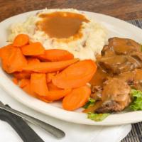 Pot Roast Dinner · Slow roasted for 8 hours and served with mashed redskin potatoes, gravy, and roasted carrots.