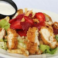 Crispy Chicken And Strawberry Salad · Fresh romaine topped with diced fried chicken strips, fresh strawberries, sliced almonds, an...