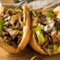 Philly Steak Sub · Seasoned thinly sliced sirloin steak, with cheese, green pepper, onion, tomatoes, lettuce, m...