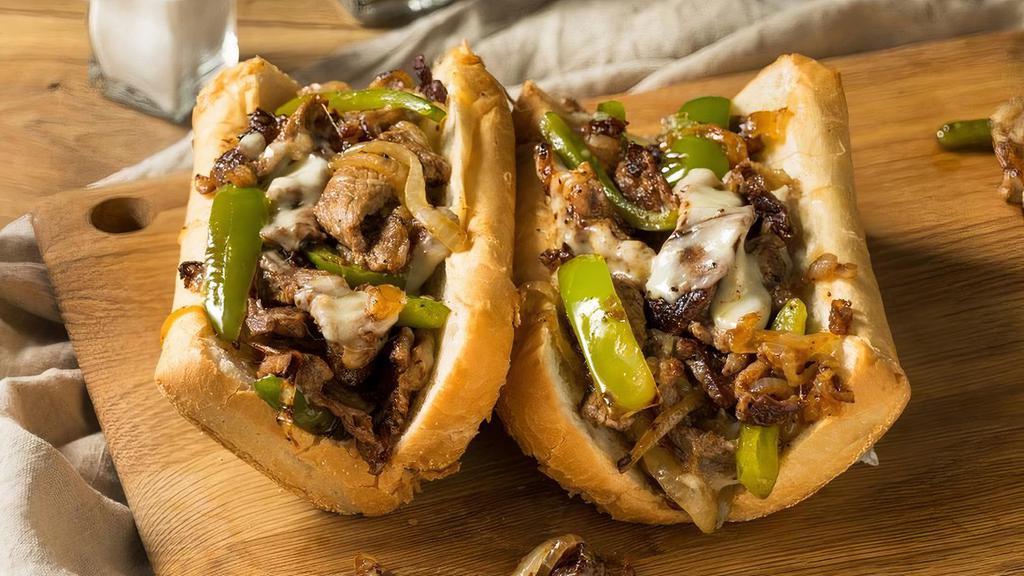 Philly Steak Sub · Seasoned thinly sliced sirloin steak, with cheese, green pepper, onion, tomatoes, lettuce, mushroom, and banana peppers & mayo