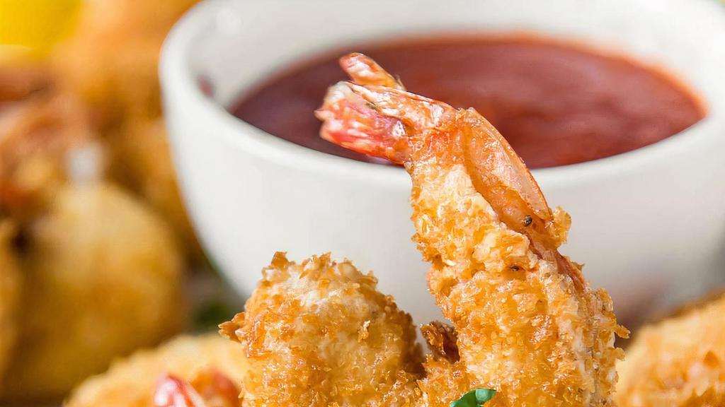 Coconut Shrimp (8) · Served with sweet chili sauce.