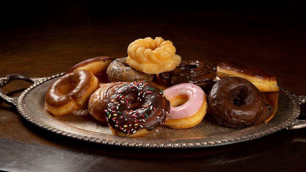 Dozen Special Donuts (Glazed & Donut Mix) · Round donuts(glazed and cake kinds)only. Additional charge for French crullers:
 $0.20/each of French Crullers
