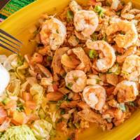 Camarones De Cozumel Lunch · Grilled shrimp, chicken and pico de gallo sauteed in our spicy butter sauce served on a bed ...