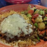 Pollo Ala Parilla · Grilled chicken breast on a bed of rice covered with Monterrey jack cheese, choice of mixed ...