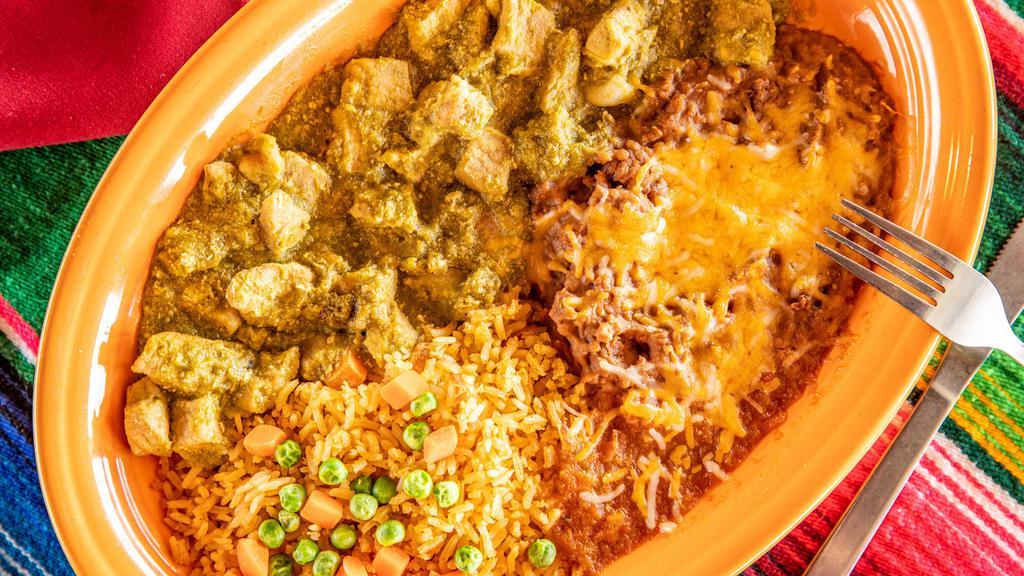 Carne De Puerco Con Chile Verde · Selected chunks of pork and green chile sauce served with rice and refried beans.