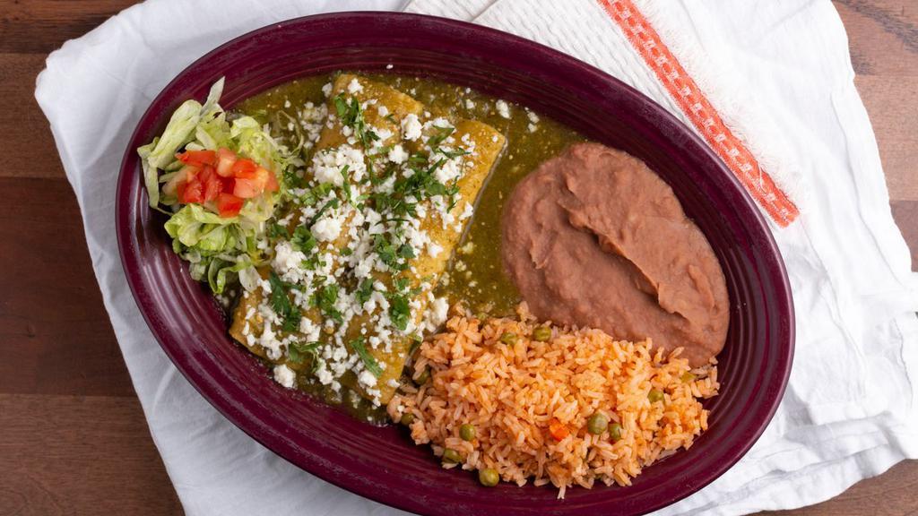 Enchiladas Zacatepec · Two chicken enchiladas are topped with green chile sauce, Mexican white cheese & cilantro. Served with sopa & your choice of Spanish rice, refried beans or black beans.