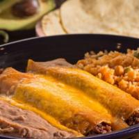 Guillermo’S Enchiladas De Carne · Two beef or cheese enchiladas topped with chile gravy and melted cheddar cheese. Served with...