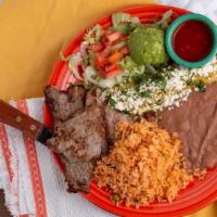 Carne A La Tampiqueña · Gluten free. A 4oz ribeye steak served with a salsa picante & one chicken enchilada topped w...