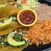Fajita Tacos · Two soft corn tortillas filled with onions and tomatoes with your choice of grilled seasoned...