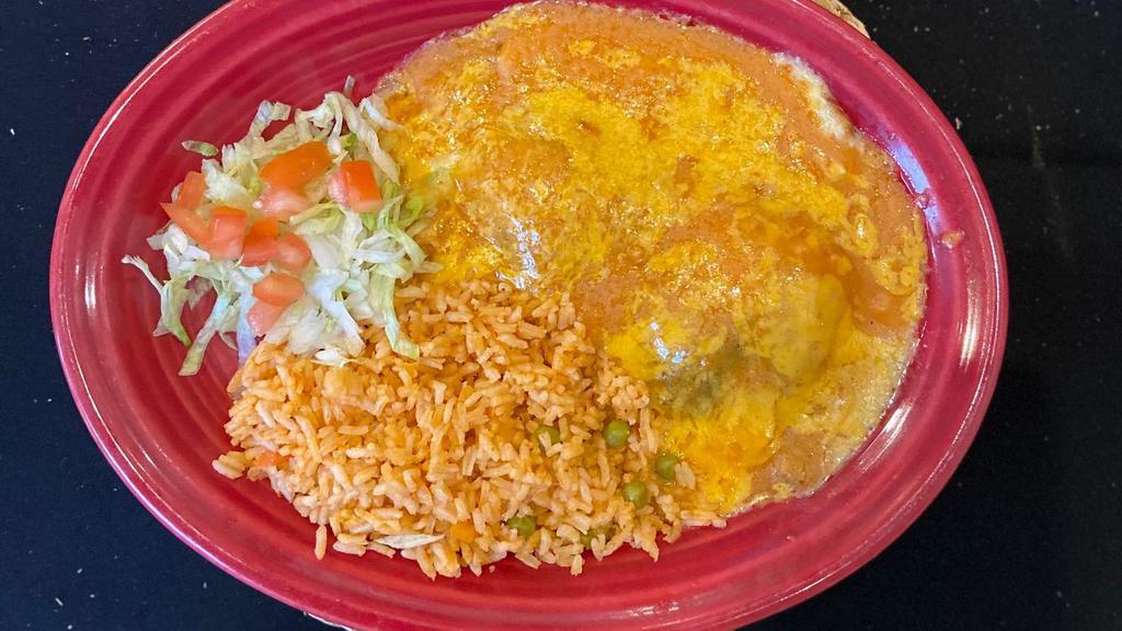 Chile Relleno · Vegetarian. A mild green pepper stuffed with cheese & onion, dipped in egg batter deep fried. Topped with your choice of traditional style caldillo (broth) or tex-mex style with gravy and melted cheddar cheese. Served with sopa & your choice of Spanish rice, refried beans or black beans.