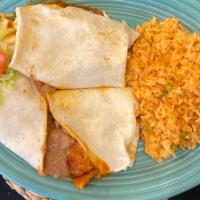 Burritos Norteños · Two soft flour tortillas filled with refried beans & spicy pork sautéed in red chile chipotl...