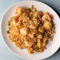 Seafood Fried Rice · Includes shrimp and scallops crab meat peas carrots.
