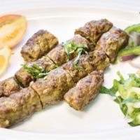 Sheek Kabob · Ground lamb mixed with herb and cooked in clay oven.