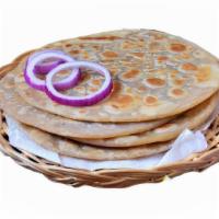 Paratha · Buttered and leavened flour bread.
